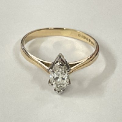 Certificated 14ct yellow and white gold marquise cut diamond solitaire ring. Diamond 0.60ct. Cert no. WGI9624142692. Postage category A.