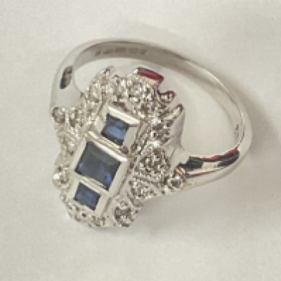 14ct white gold art deco style sapphire and diamond ring. Step cut sapphires 0.40ct approx. R/C diamonds 0.18ct approx. Postage category A.