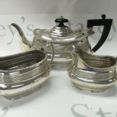 A three piece siver tea set Chester hallmarks.