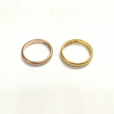 A 22ct wedding band and a 9ct rose gold wedding band. Approx weight 7.6 grams.