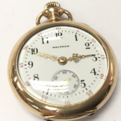A gold plated Waltham pocket watch. Postage category A