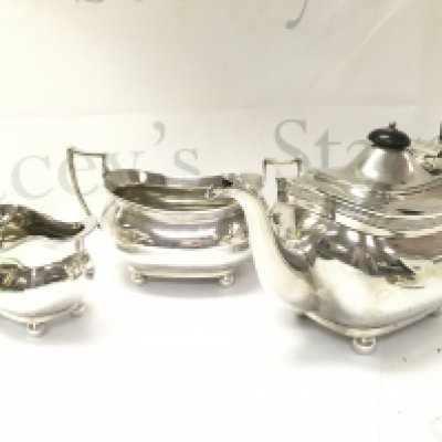 Three piece silver tea set including a teapot, milk jug and sugar bowl. Postage category C