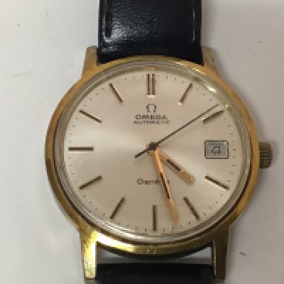 A Gents Vintage Omega Automatic watch with date Aperture the reverse with personal inscription seen working.