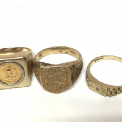 Three 9carat gold gents ring set with a small Mexican gold coin 1945 dos pesos total weight of the three coins 21g