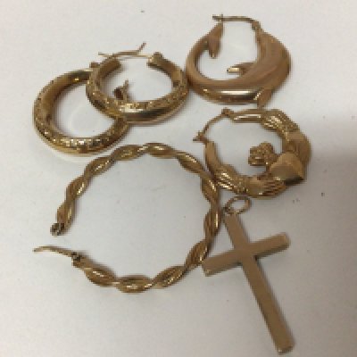 A collection of gold earrings one pair unmarked and a 9carat gold cross. Weight 10g