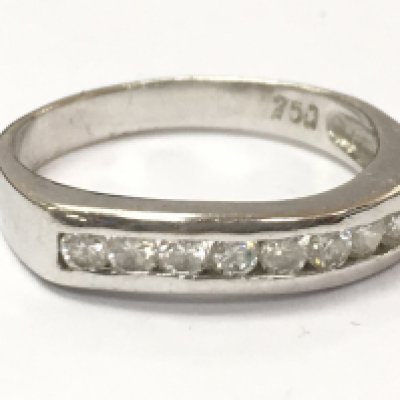 An 18ct white gold diamond 1/2 hoop ring. 3.6g total weight, size N. Postage category A
