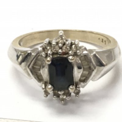 An 18ct white gold sapphire and diamond cluster ring, 5.7g total weight. Postage category A