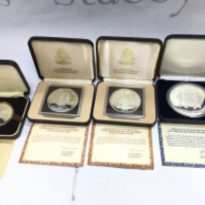 A collection of silver coin including a 1979 Jamaica 25 dollar silver proof coin. Postage B