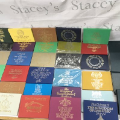 A large collection of coin collection sets. Postage B