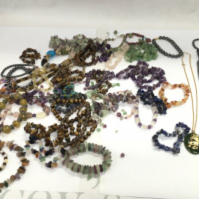 A collection of approx 40 semi precious stones and polish stone necklaces. Postage B