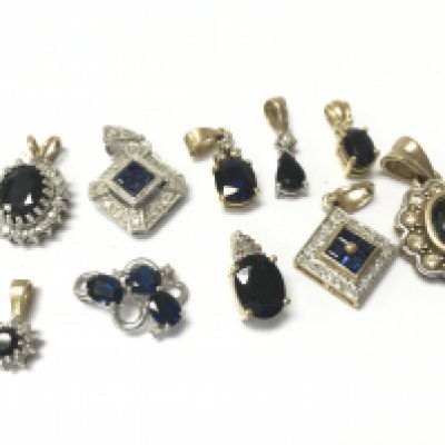 9ct gold collection of Mixed sapphire and diamond pendants, 12.2g. Postage category a