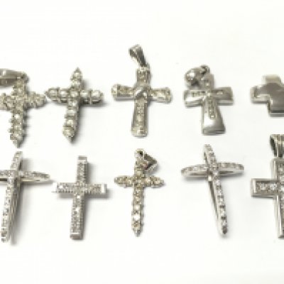 9ct And 18ct White gold cross pendants set with small diamonds, 12.6g total weight . Postage category A