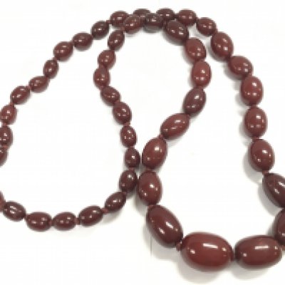 A graduated cherry amber bakelite beads necklace. Approx 88cm long weight 102g Postage B