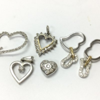 18ct white gold diamond heart pendants , 12.1g total weight. Postage category A