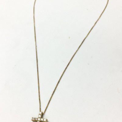 An 9ct gold diamond inset cross pendant with a 18ct gold chain , 3G total weight. Postage category A