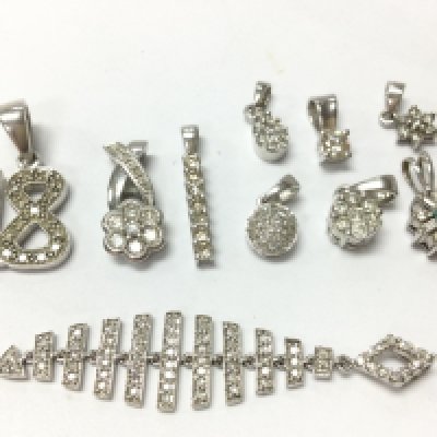 Mixed white 9ct gold diamond inset pendants , 10.7g total weight, postage category A