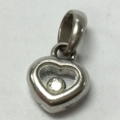 An 18ct white gold Chopard heart pendant with diamond stone , 2.4g total weight. Postage category A