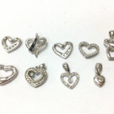 9ct white gold diamond set pendants , 9.66g total weight. Postage category A