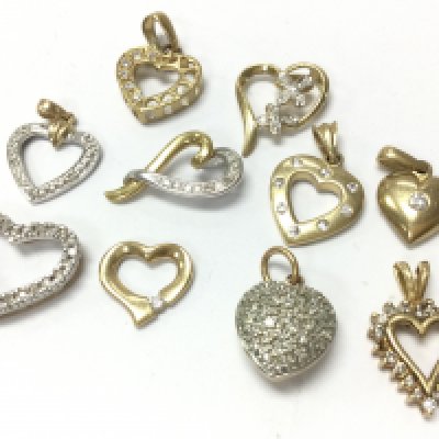9ct Gold heart pendants set with diamond stones , 12.5g total weight. Postage category A