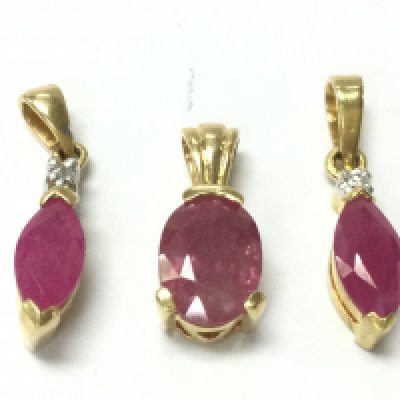 18ct gold ruby pendants set with small diamond stones, 3.63g total weight . Postage category A.