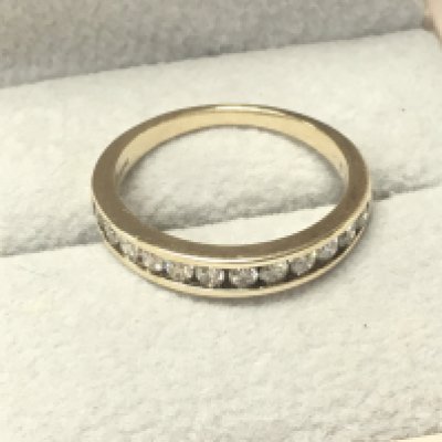A 9ct gold half hoop eternity ring ,0.5ct total diamond. Size N . 2g total weight. Postage category A