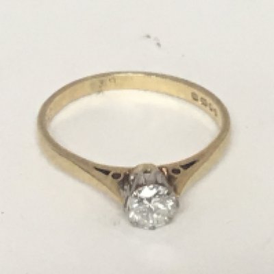 An 18carat gold diamond solitaire ring approximately 0.39 of a carat the shank marked accordingly ring size M weight 2g