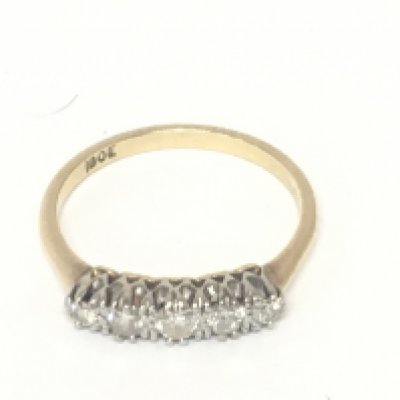 An 18carat gold ring set with a row of five diamonds ring size V weight 3.9g