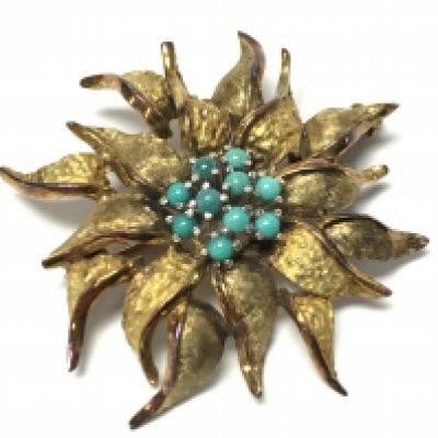 A 14ct gold brooch set with turquoise in the form of a flower , stamped 585. 7.3g total weight. Postage category A