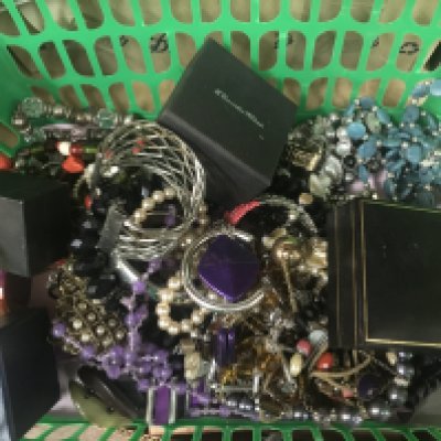 A box of costume jewellery including bangles, necklaces , bracelets etc . Postage cat B