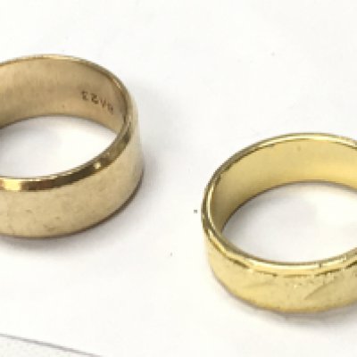 One 9ct gold band, approx, and one yellow metal ring.