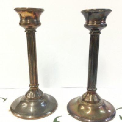 A pair of hallmarked silver candlesticks , 18Cm tall . Postage category B