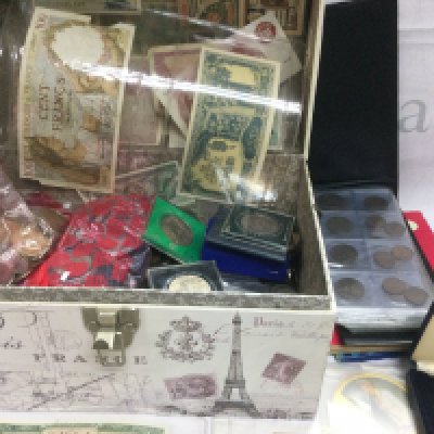 A box of mixed coins and banknotes including some silver. Shipping category D.