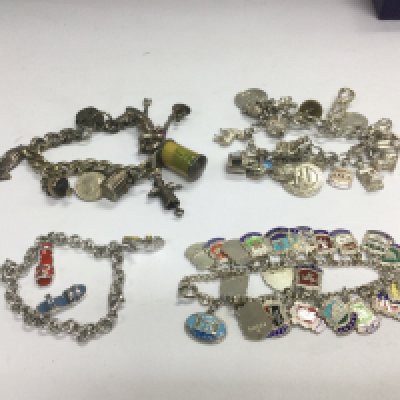 Four silver charm bracelets. Shipping category A.