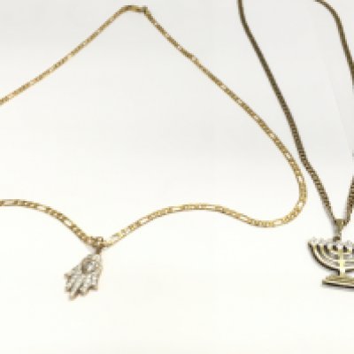 Two 9ct gold chain with 9ct pendants. Total weight 21.64g Postage A