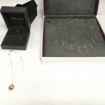 A silver Georg Jensen and a silver Beaverbrooks necklace. Postage A