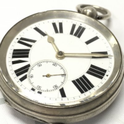 An oversized Goliath silver pocket watch, seen working. Postage category A