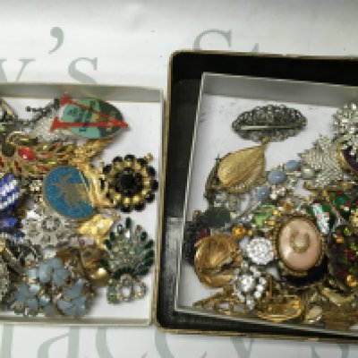 Two trays of mixed brooches, postage category B