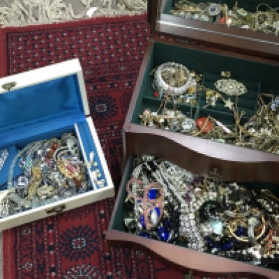 Two boxes of costume jewellery including necklaces, brooches, earrings etc. postage category C