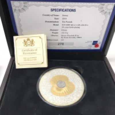 A 5oz silver poppy coin with gold plating and COA.