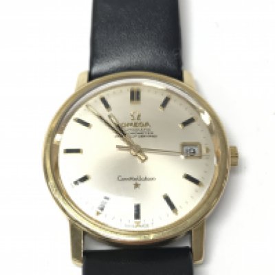 A vintage gents omega wrist watch. Model ref 168018. Automatic movement which is running well. Gold case with steel back. 35mm case with silver colour dial. Black leather strap (aftermarket). Original paperwork and some service documentation. Nice condition with some light wear related marks. Postage B