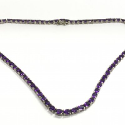A silver and amethyst necklace, postage category a