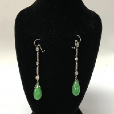 A fine pair of 1930s white gold and diamond and polished apple green jade drop earrings together with an identical pendant 5.3cm drop. (A)