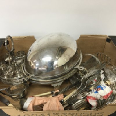 A box containing silver plate including a breakfast dish egg cup set.