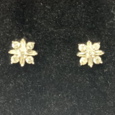 A pair of 9ct white gold diamond earrings. Postage category A.