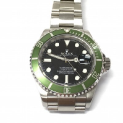 A rolex submariner date Kermit watch. 16610 Black dial with green bezel. 2007/2008 40mm case with stainless steel bracelet. Seen running. No box or papers.