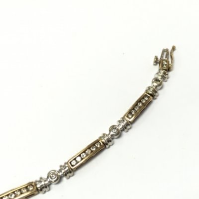 9ct yellow and white gold diamond set tennis bracelet with approximately 1ct diamonds. 19cm long