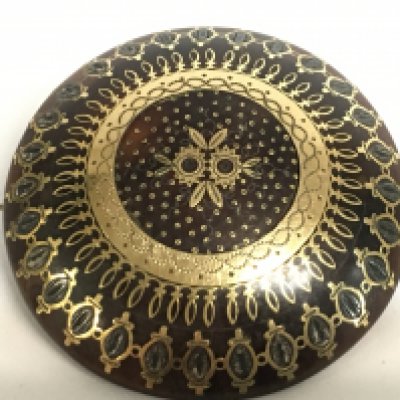 A Victorian tortoiseshell and gold brooch. Postage category a