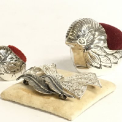 Silver pin brooches and silver chick pin cushions. Postage category a