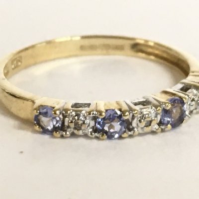 A 9 carat set with a tanzanite stone and small diamonds. Size K. 1.2g. Postage category A