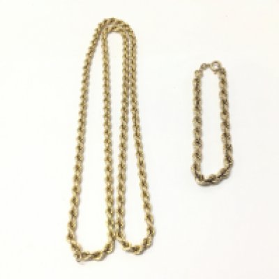 A 9ct gold necklace and a 9ct gold bracelet. 27.94g Postage A